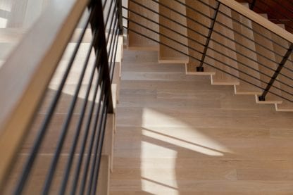 Select grade five inch white oak plainsawn floors and matching stairs.