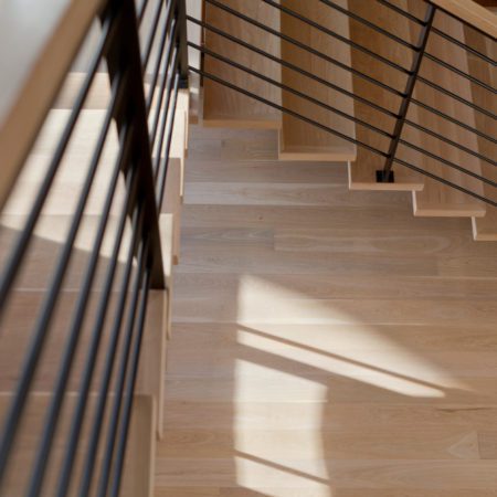 Select grade five inch white oak plainsawn floors and matching stairs.