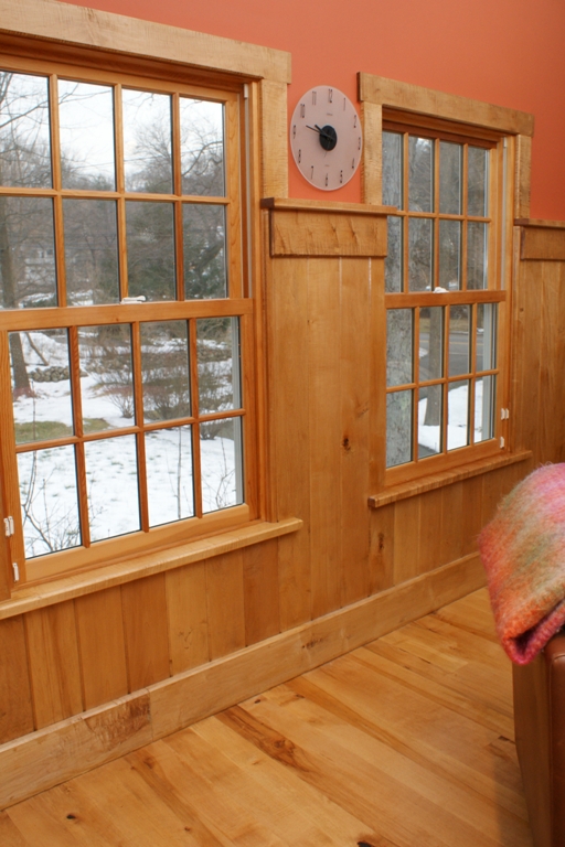 Maple wood flooring with maple tongue and groove wall paneling and tiger maple trim.