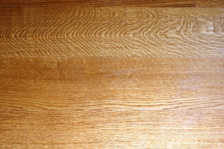 Close up view of the grain of quarter/rift sawn White Oak flooring.