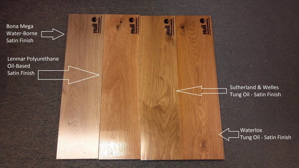 White Oak floor boards labeled with different finishes applied for comparison purposes
