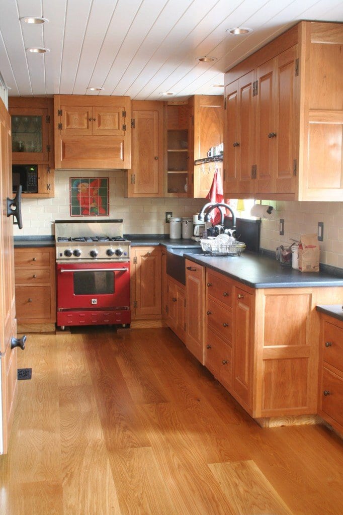 White Oak floors same tone as the wood in the cabinets of this kitchen.