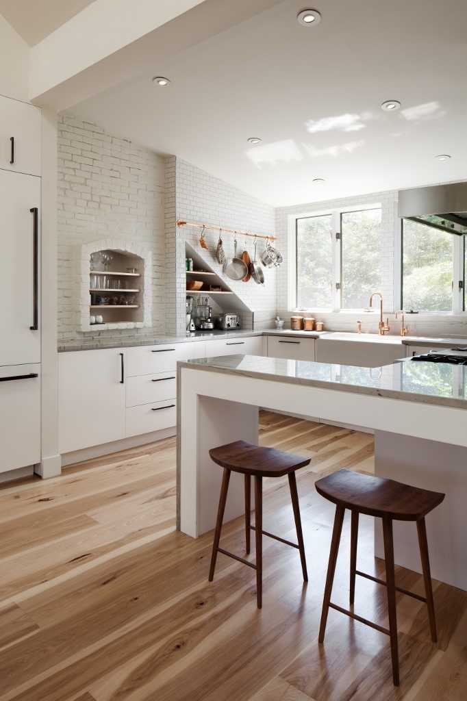 Wood Flooring Warms Up A White Kitchen